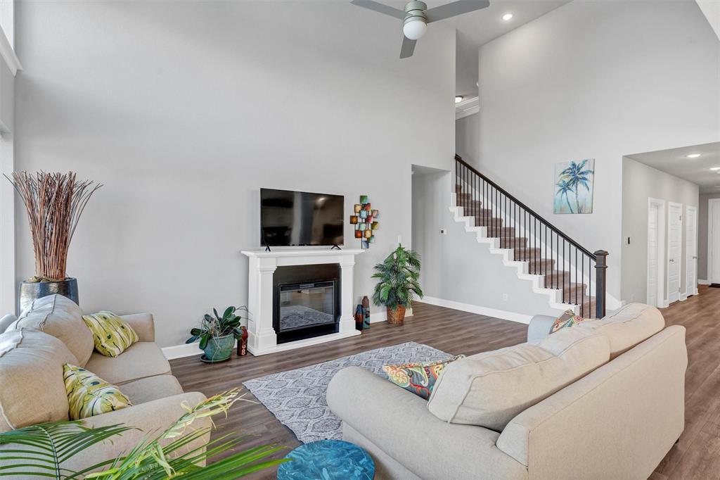 7500 Foxgrass Place Fort Worth, TX 76123 - Photo 25 of 29 a living room with furniture and a fireplace