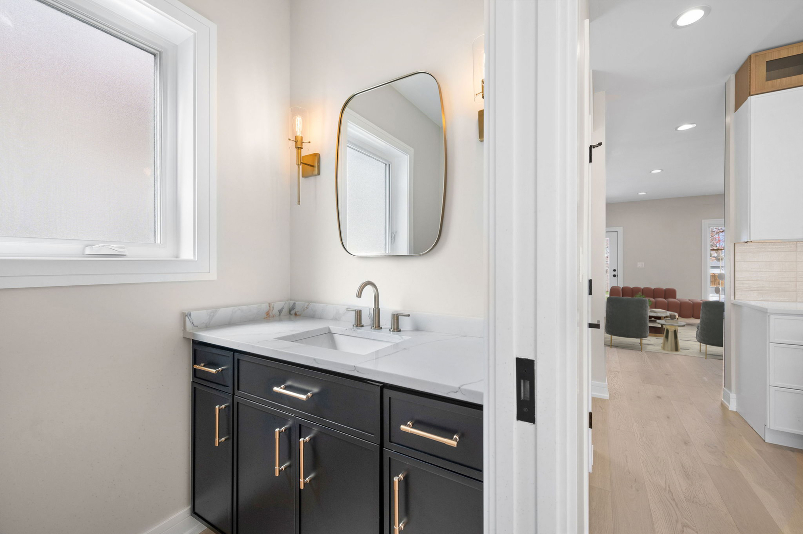 5825 West Byron Street Chicago, IL 60634 - Photo 11 of 33 a en suite bathroom with a granite countertop sink a mirror and a wooden floors