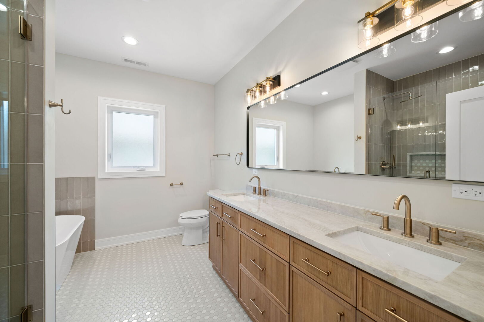 5825 West Byron Street Chicago, IL 60634 - Photo 13 of 33 a spacious bathroom with a granite countertop sink mirror and a toilet