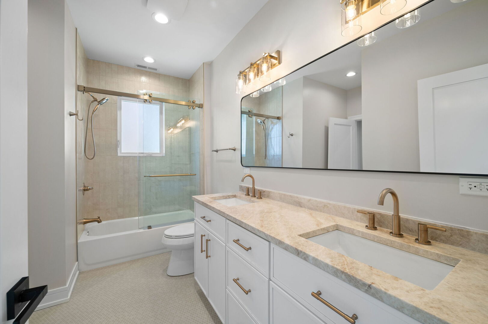 5825 West Byron Street Chicago, IL 60634 - Photo 17 of 33 a bathroom with a granite countertop sink a toilet a large mirror and shower