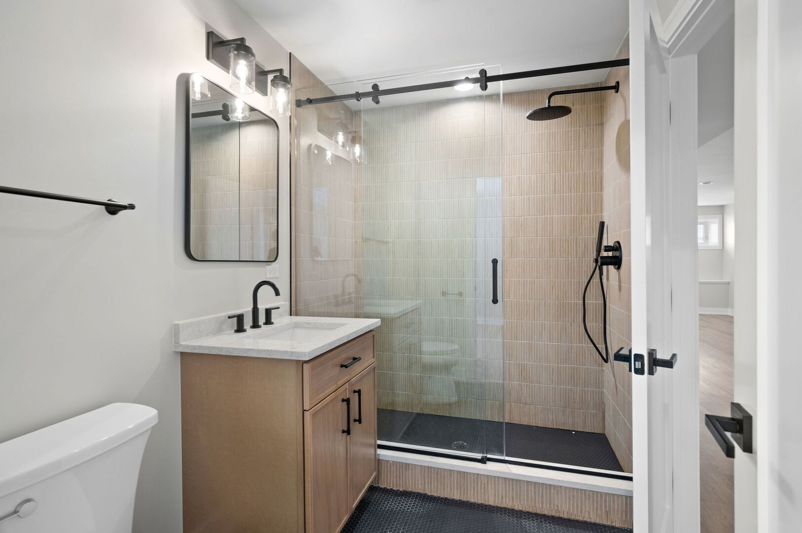 5825 West Byron Street Chicago, IL 60634 - Photo 23 of 33 a bathroom with a shower a toilet and sink