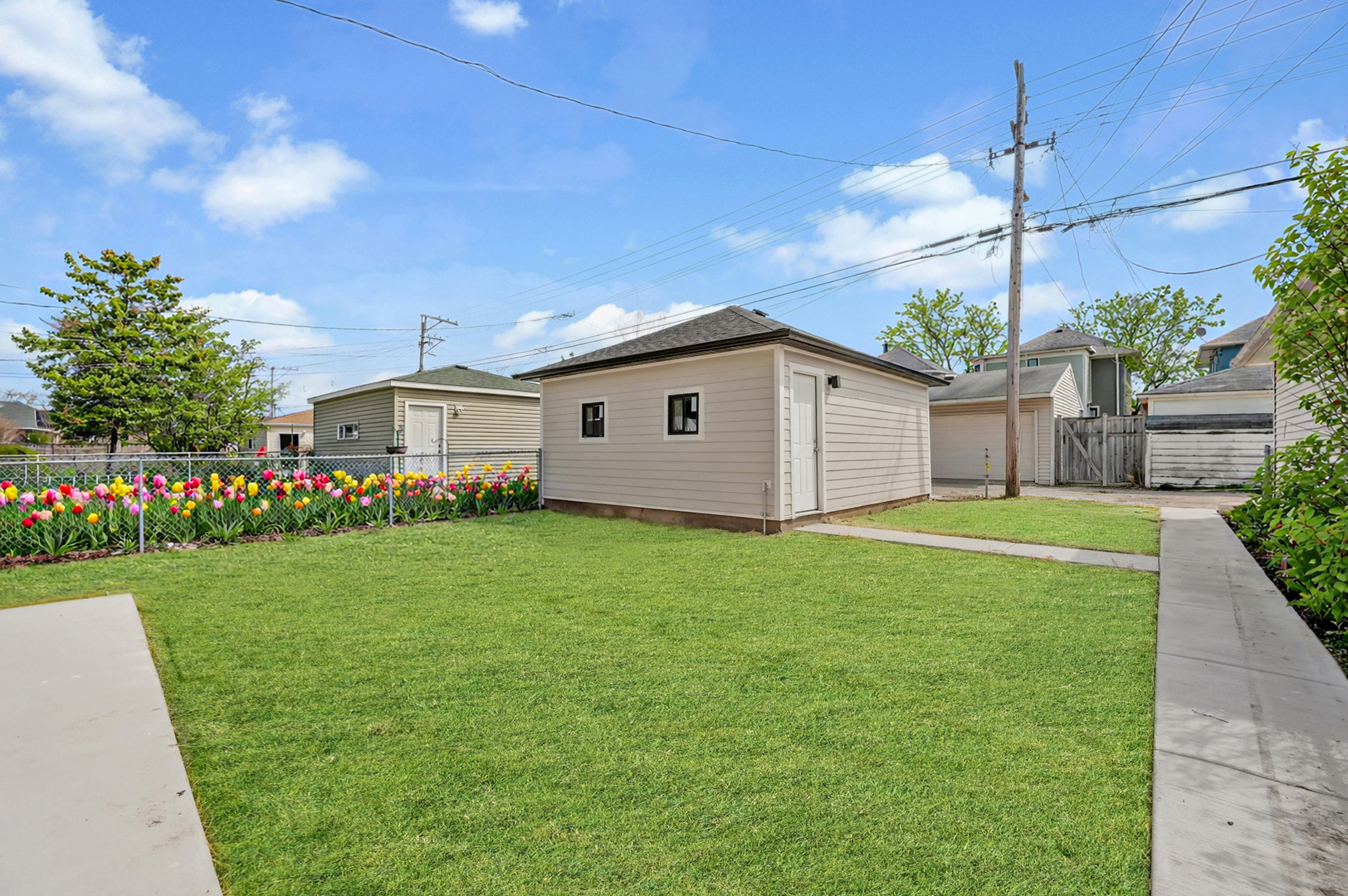 5825 West Byron Street Chicago, IL 60634 - Photo 27 of 33 a view of a house with backyard and garden