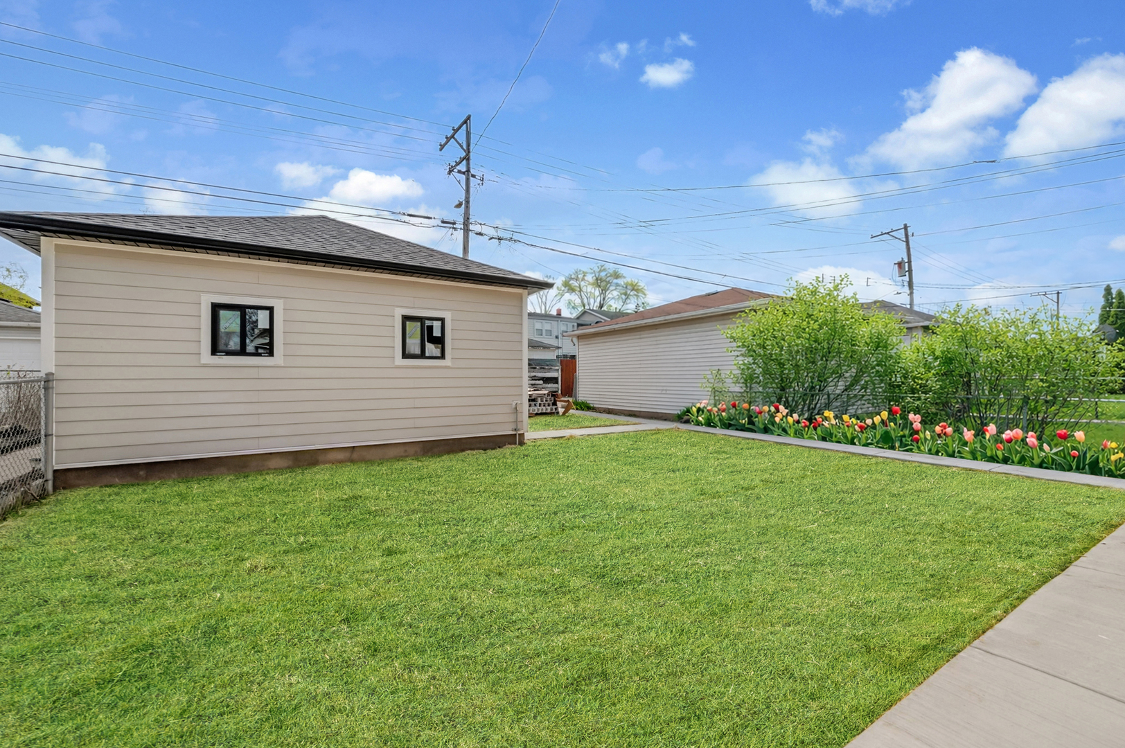 5825 West Byron Street Chicago, IL 60634 - Photo 28 of 33 a front view of a house with garden