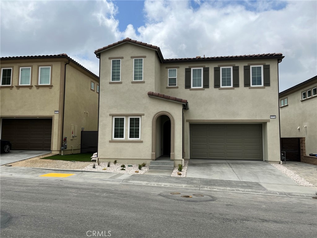 20716 Walnut Circle Porter Ranch, CA 91326 - Photo 1 of 1 a front view of a house with a yard