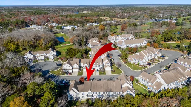 an aerial view of a house with a swimming pool