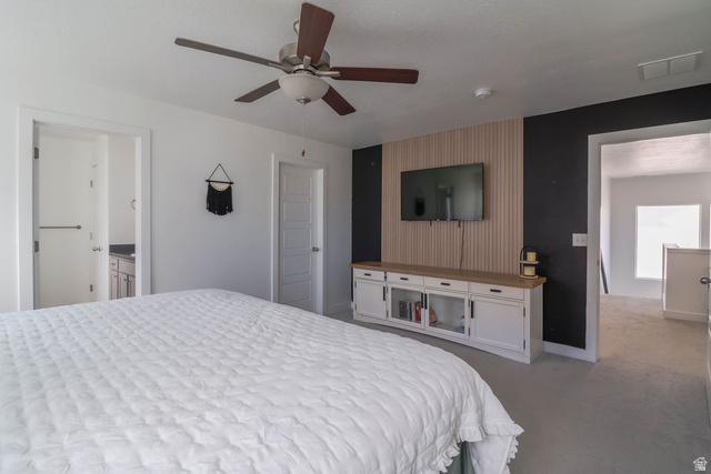 373 Quartz Road Tooele, UT 84074 - Photo 24 of 38 Ceiling fan with wood-finish blades, recessed lighting, and wall-mounted media console with storage