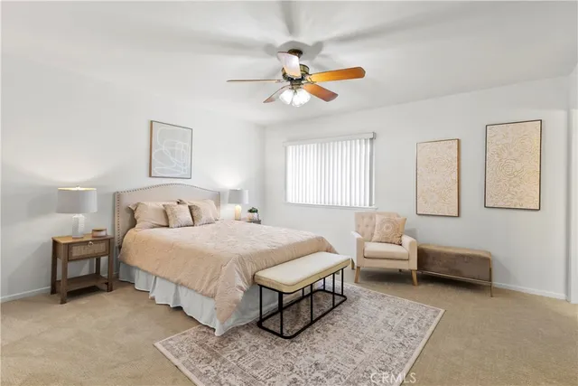 a bedroom with bed and window