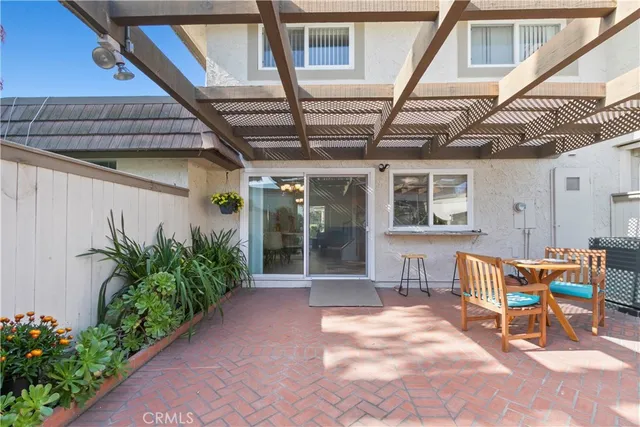 a view of a porch with furniture and a table