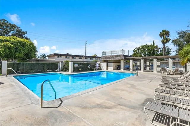 a view of a swimming pool with a patio