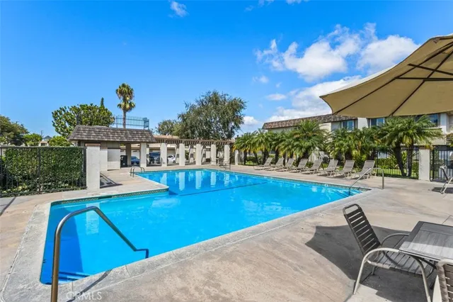 a view of a swimming pool with an outdoor seating