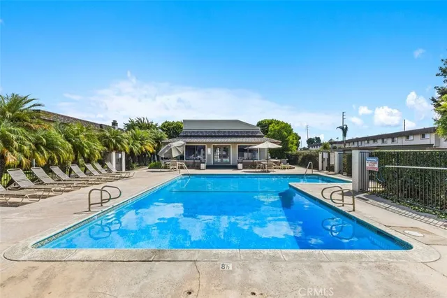 a view of a house with a wooden bench and floor