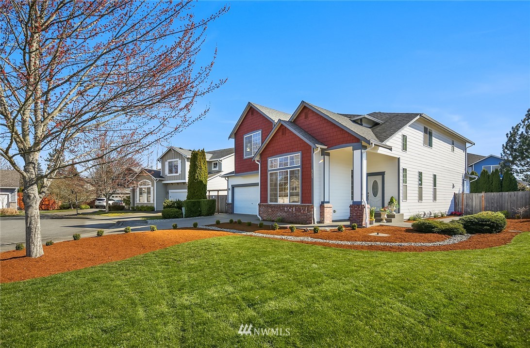 6205 Northeast 4th Court Renton, WA 98059 - Photo 3 of 22 a front view of a house with a yard