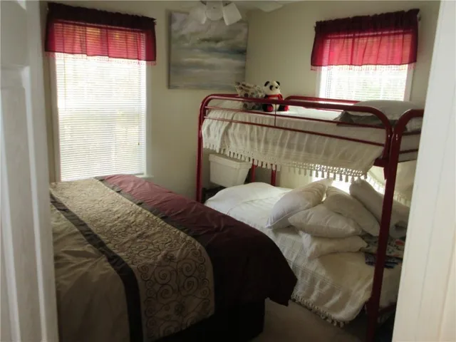 a bedroom with a bed and window