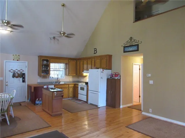 a view of kitchen with furniture and wooden floor