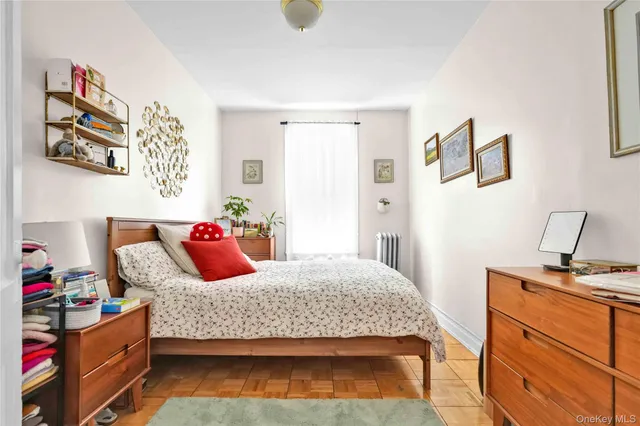 a bedroom with a bed and cabinets