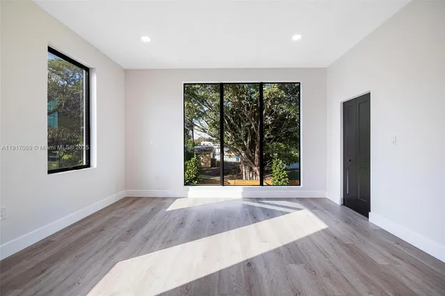 a bathroom with a double vanity sink and mirror