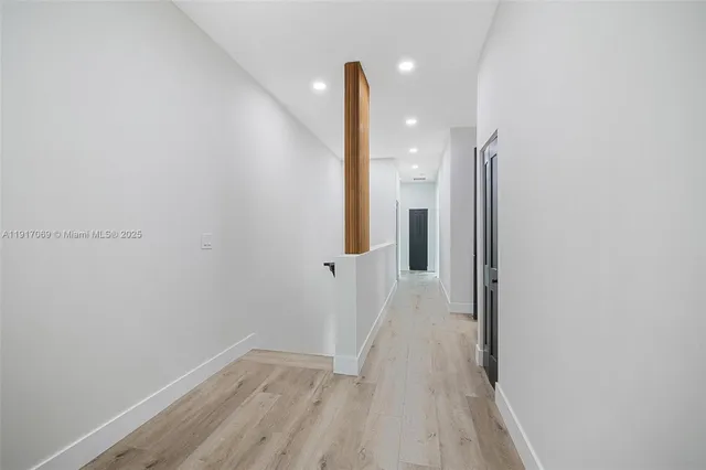 a view of a hallway with staircase