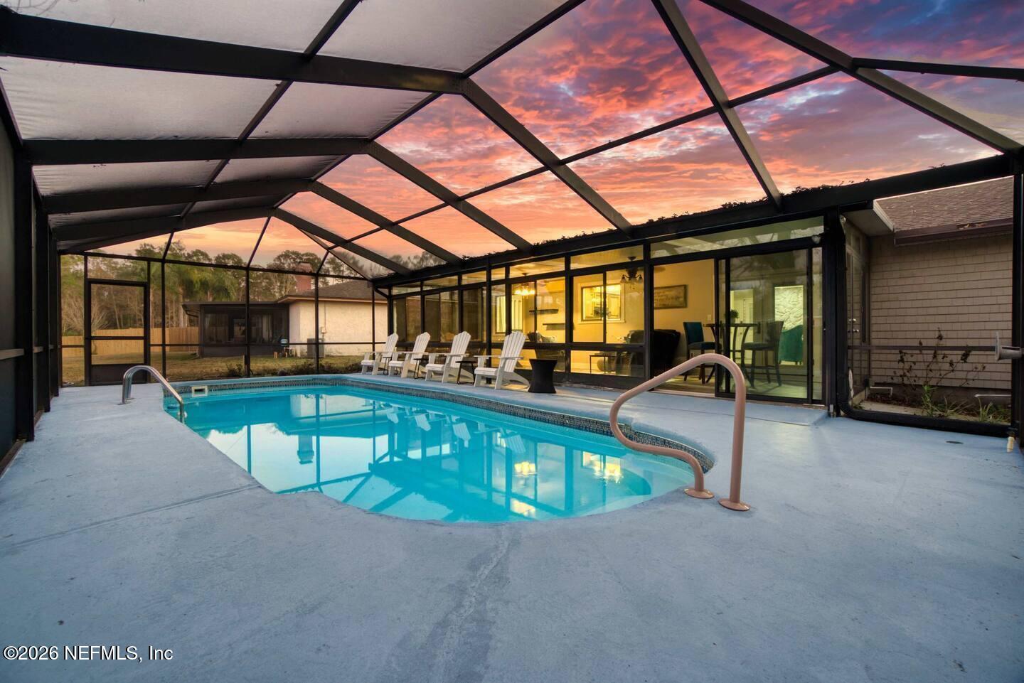 11613 Lake Ride Drive Jacksonville, FL 32223 - Photo 2 of 42 a view of a swimming pool with a patio
