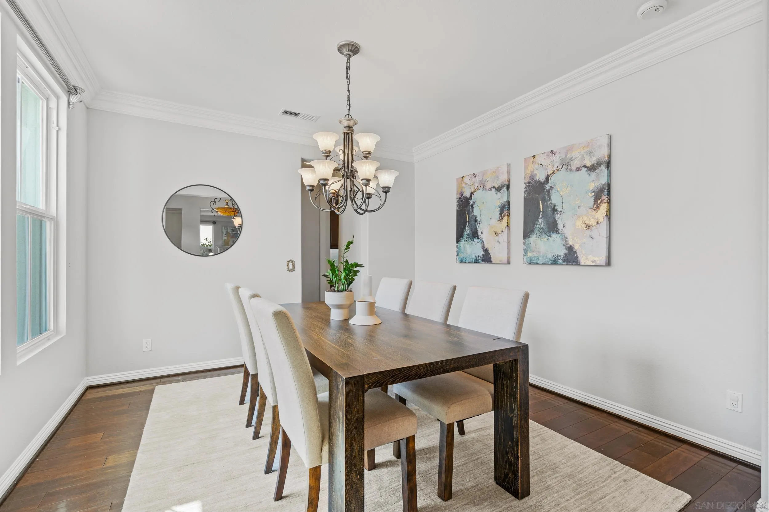 16174 Cayenne Ridge Road San Diego, CA 92127 - Photo 15 of 52 a view of a dining room with furniture and chandelier