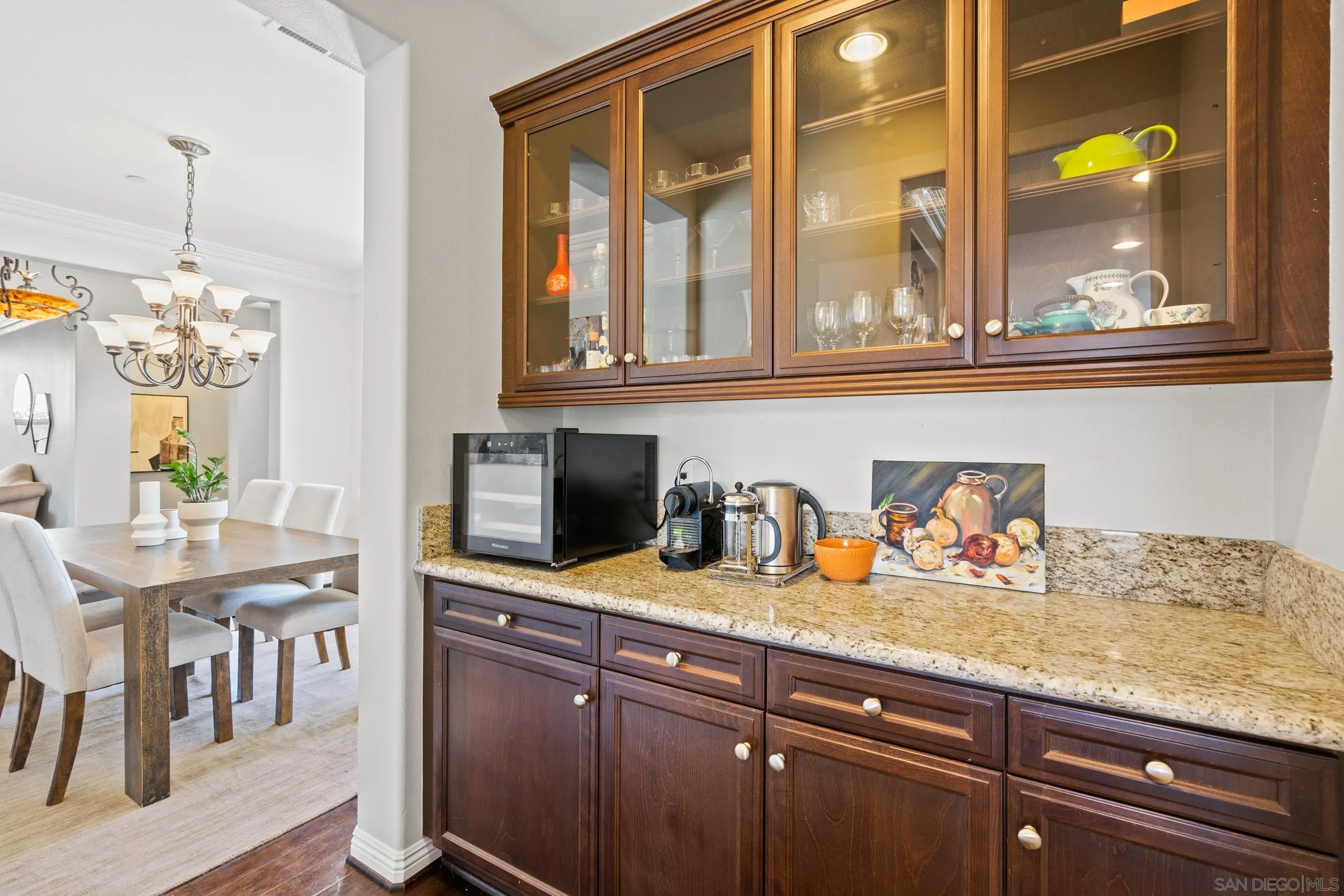 16174 Cayenne Ridge Road San Diego, CA 92127 - Photo 19 of 52 a kitchen with granite countertop cabinets and dining table