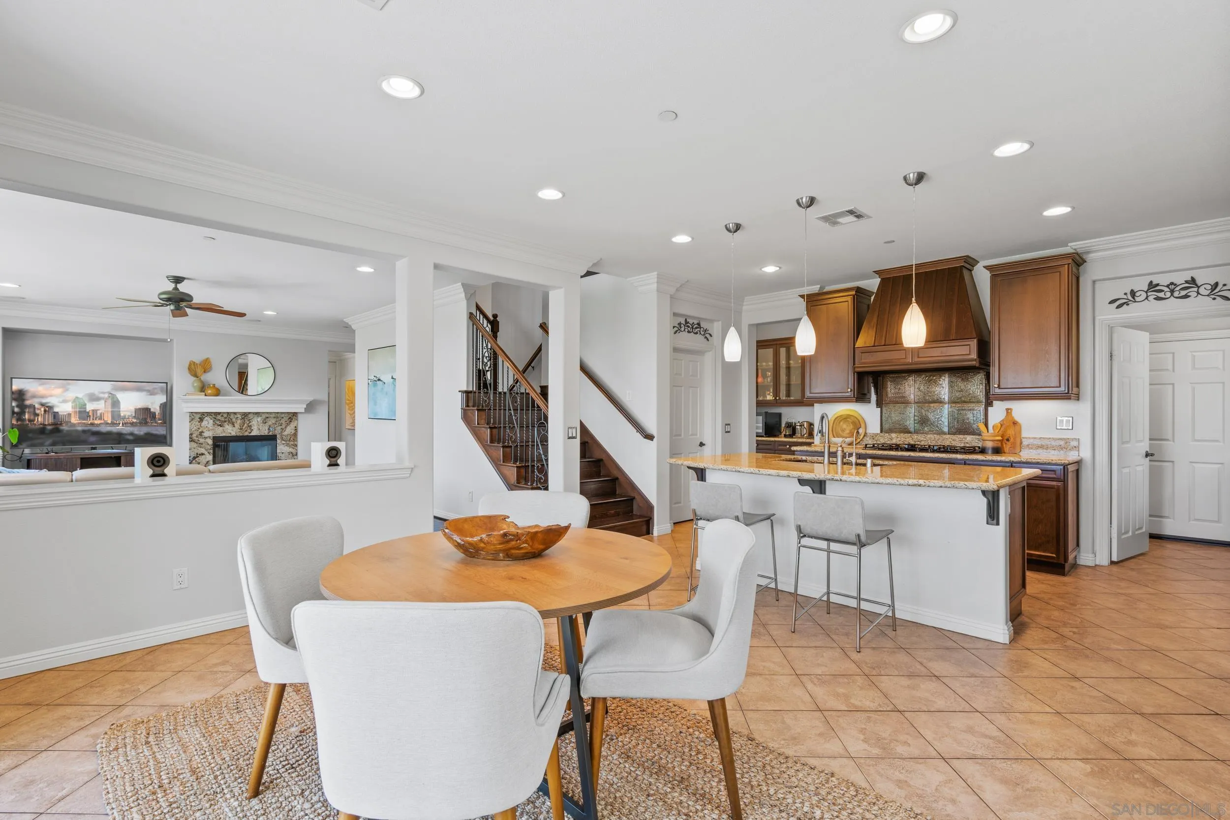 16174 Cayenne Ridge Road San Diego, CA 92127 - Photo 22 of 52 a living room with stainless steel appliances kitchen island granite countertop furniture and a kitchen view