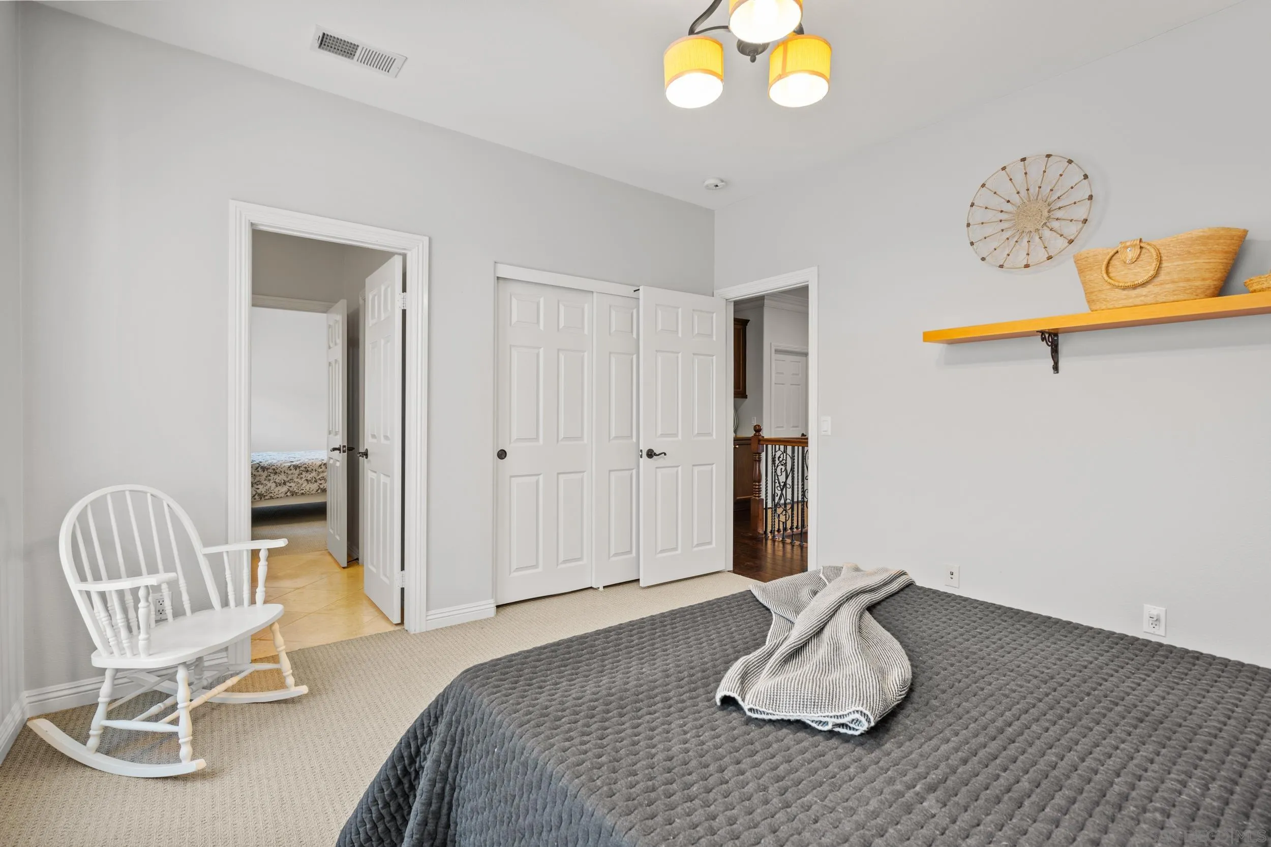 16174 Cayenne Ridge Road San Diego, CA 92127 - Photo 28 of 52 a bedroom with a bed and chair