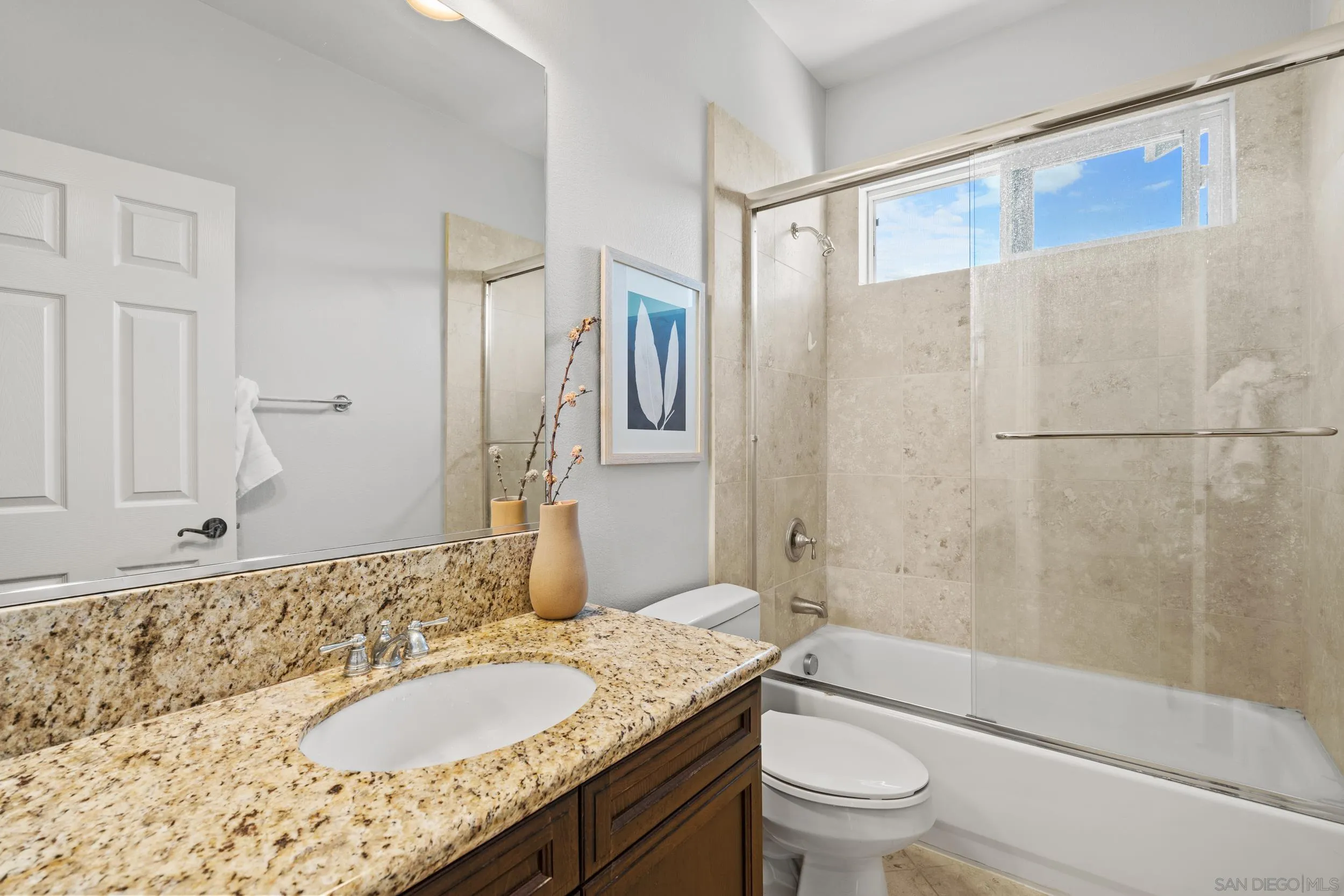 16174 Cayenne Ridge Road San Diego, CA 92127 - Photo 30 of 52 a bathroom with a granite countertop sink toilet and shower