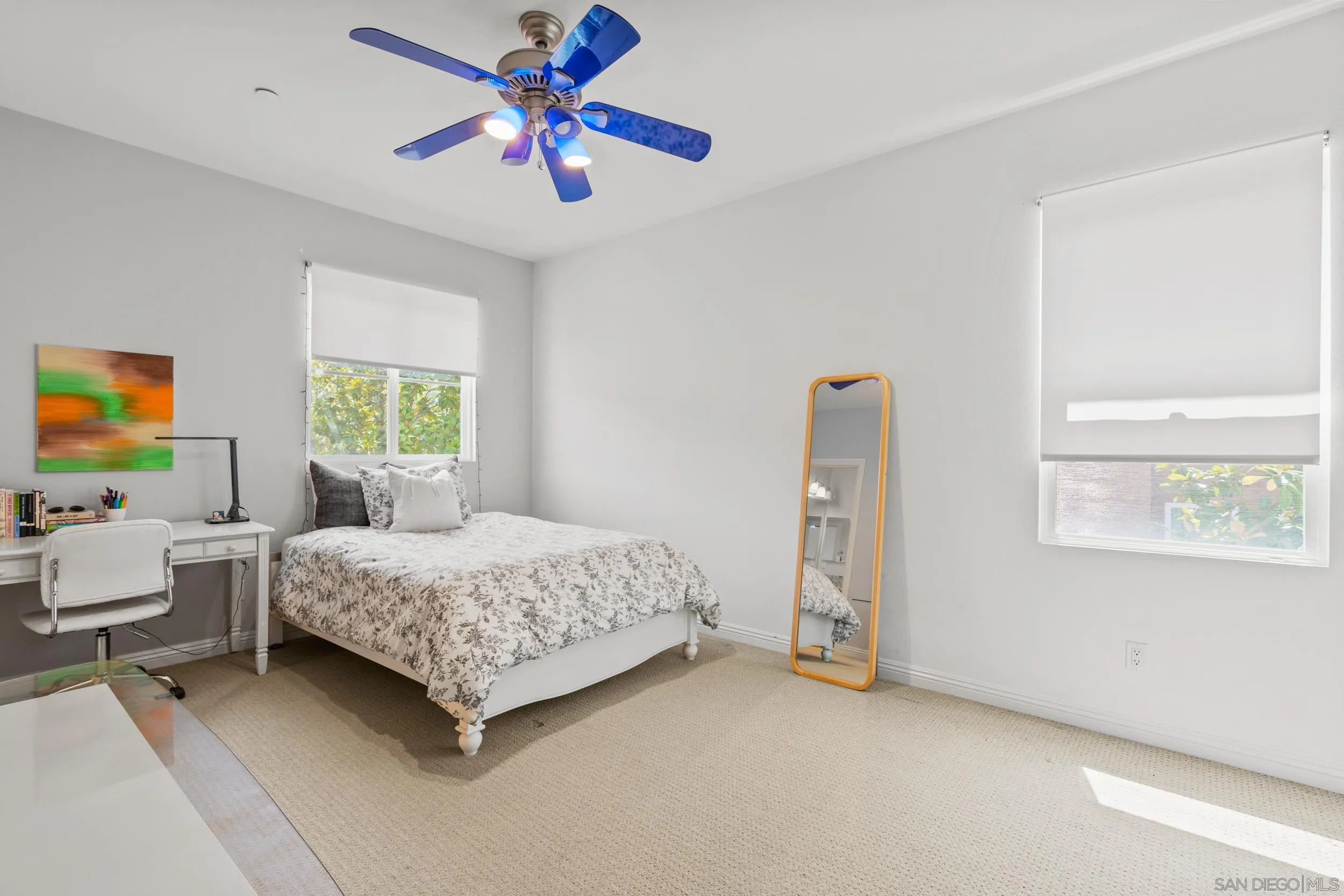 16174 Cayenne Ridge Road San Diego, CA 92127 - Photo 33 of 52 a bedroom with a bed and a chandelier