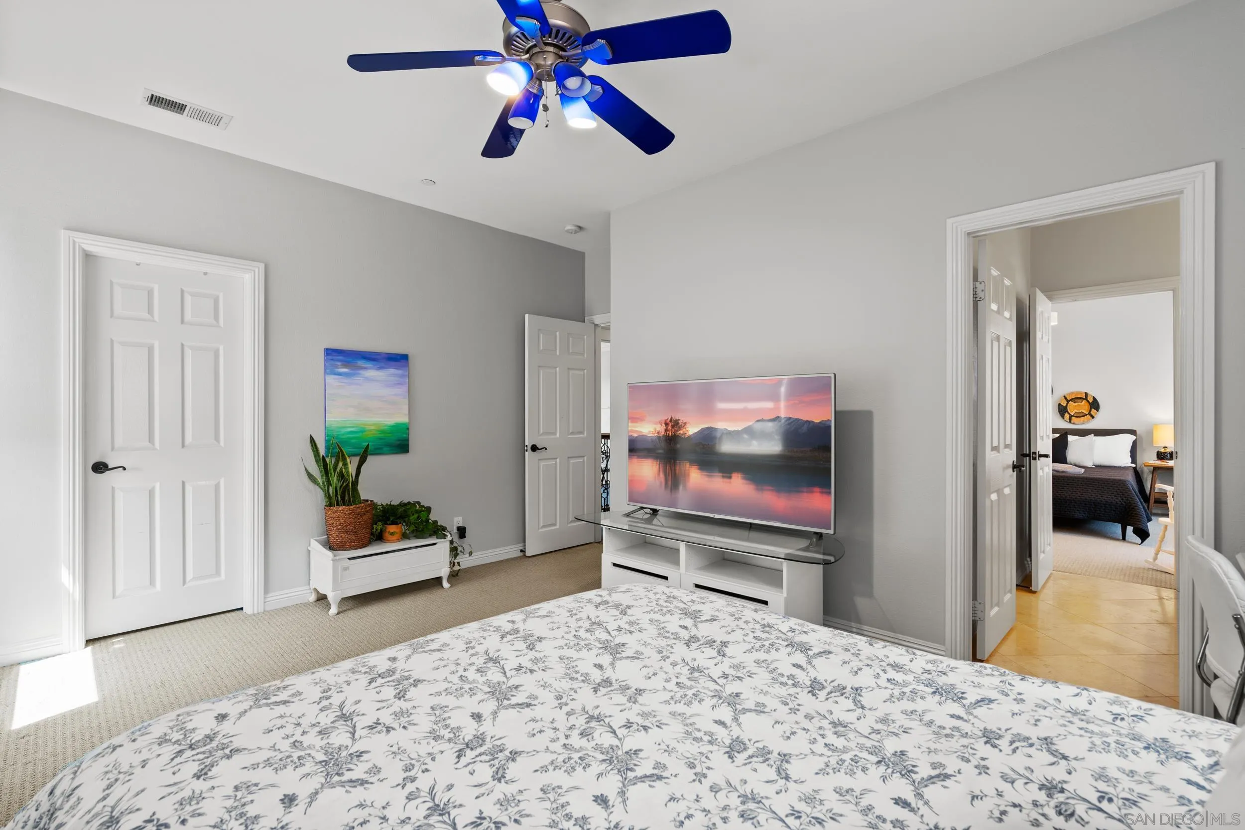 16174 Cayenne Ridge Road San Diego, CA 92127 - Photo 34 of 52 a bedroom with a bed and a flat screen tv