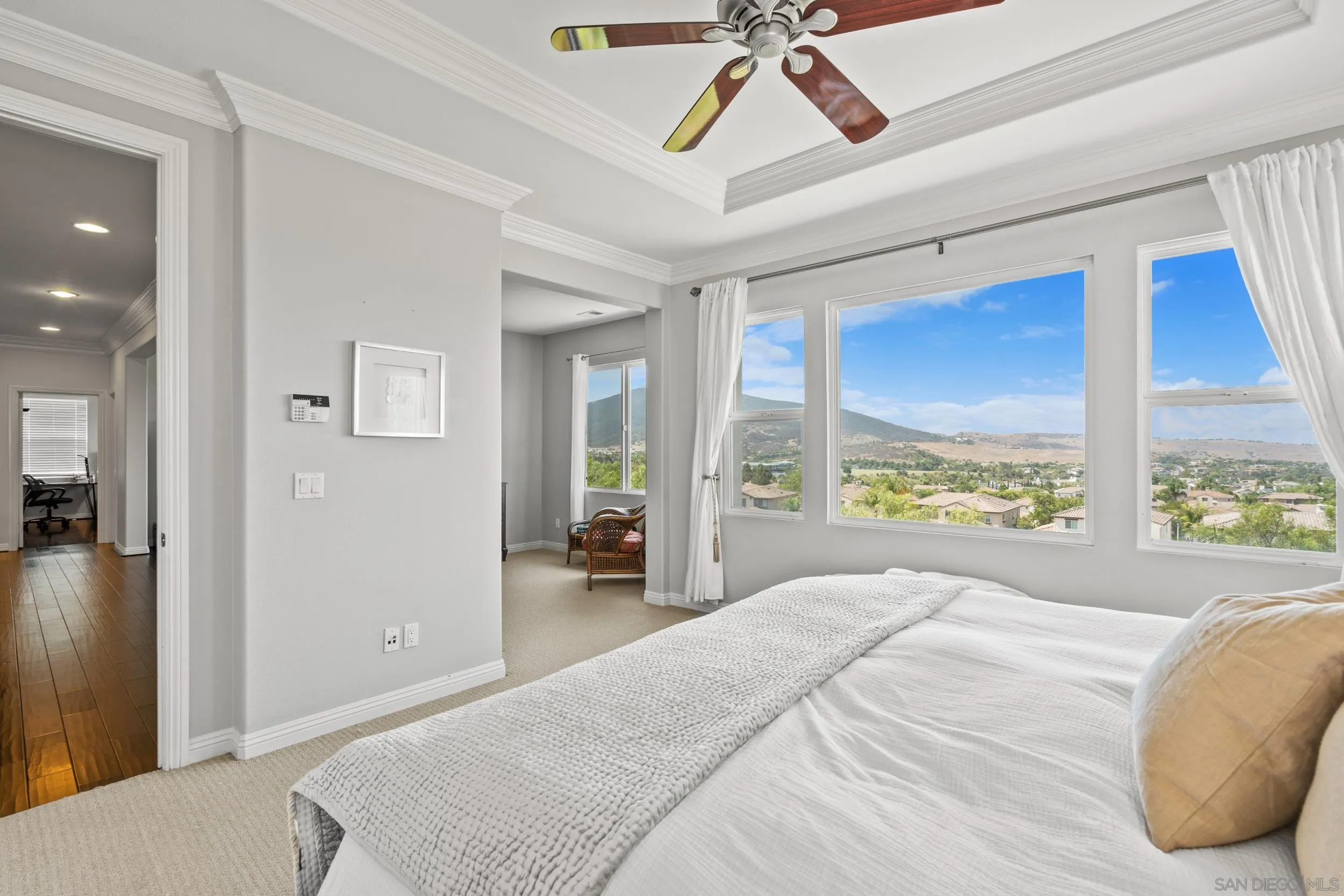 16174 Cayenne Ridge Road San Diego, CA 92127 - Photo 36 of 52 a bedroom with a large bed and a large window
