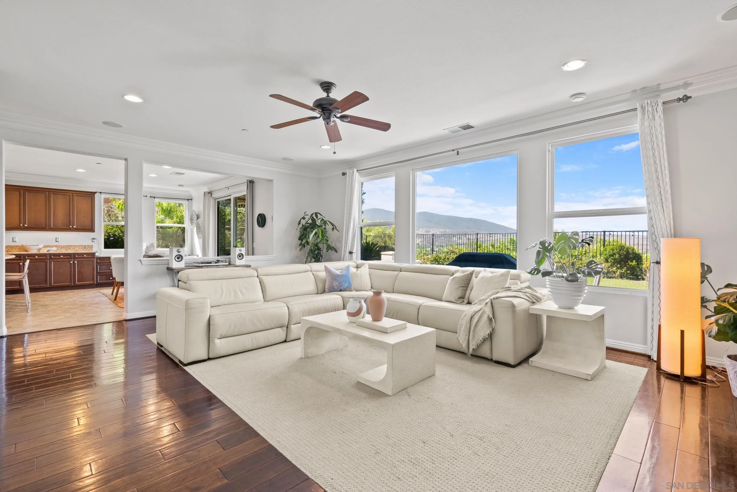 16174 Cayenne Ridge Road San Diego, CA 92127 - Photo 6 of 52 a living room with fireplace furniture and a large window