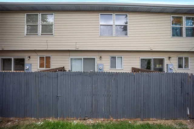 a view of a house with a backyard space