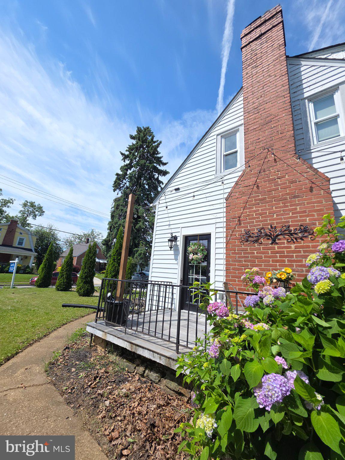 3712 West Cold Spring Lane Baltimore, MD 21215 - Photo 25 of 39 Charming home with vibrant blooms.
