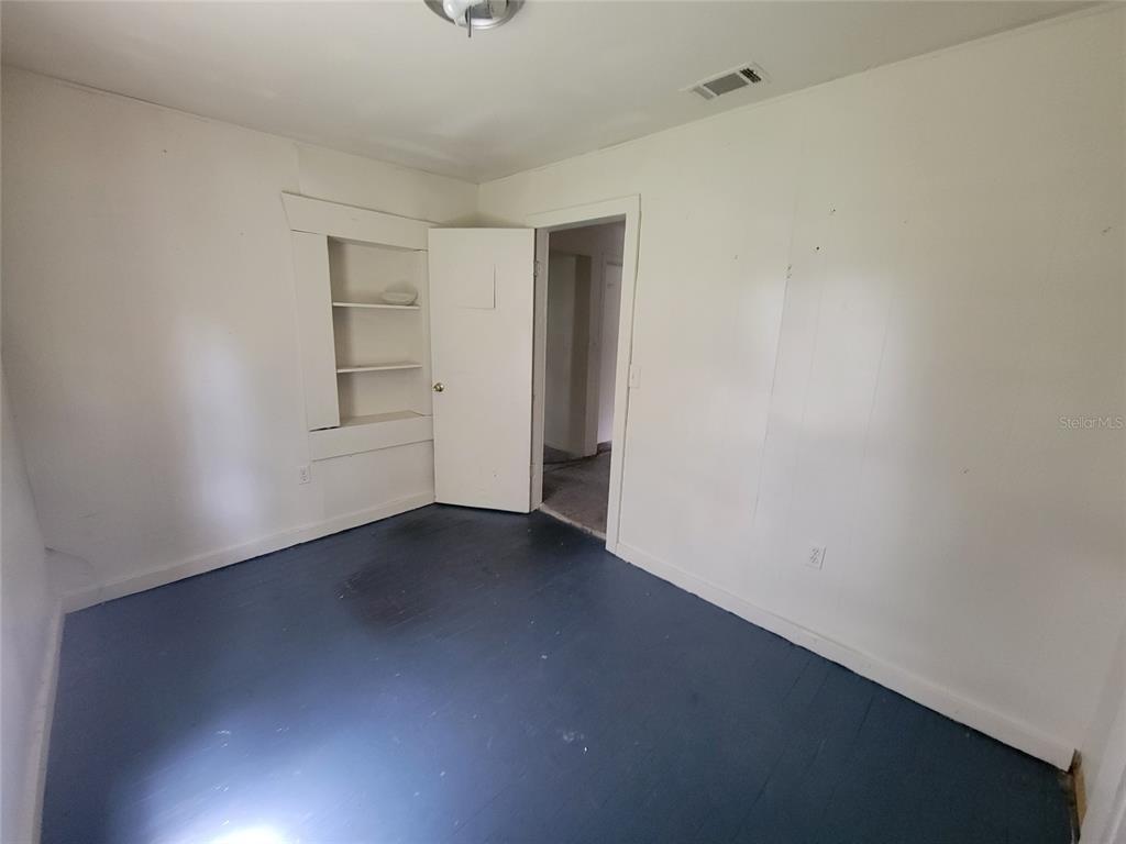 1290 Henson Lane, Unit 1 Bartow, FL 33830 - Photo 5 of 12 a view of an empty room with a window