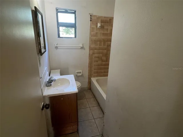 a bathroom with a sink and mirror