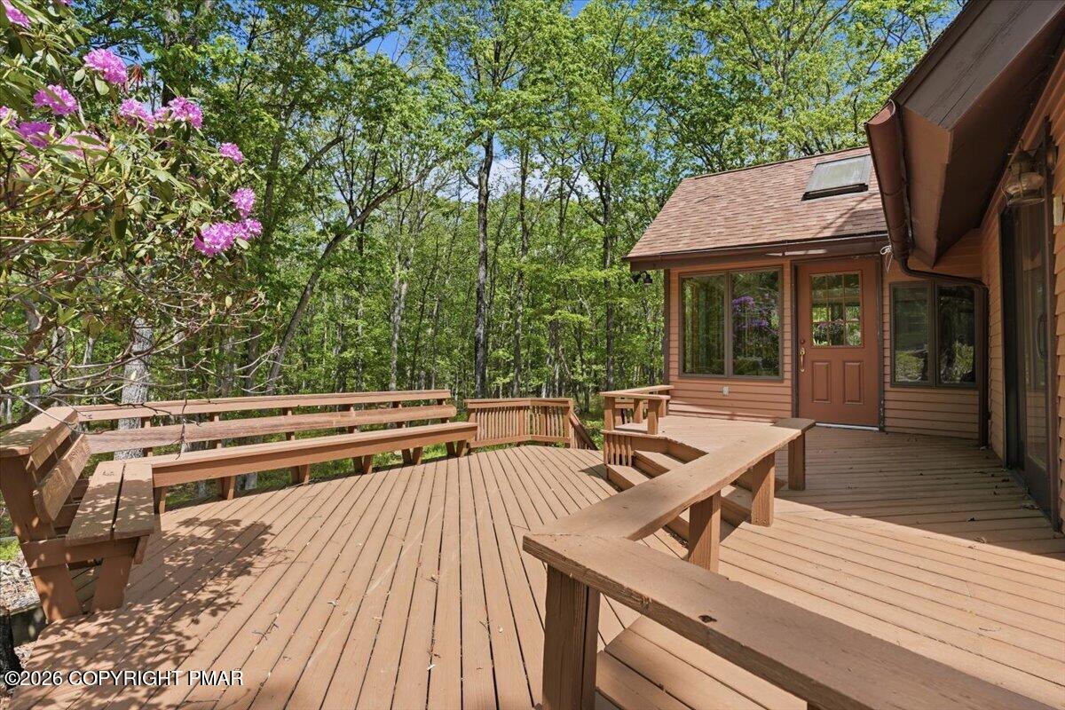 1517 Deer Run East Bushkill, PA 18324 - Photo 30 of 42 a view of a roof deck with table and chairs