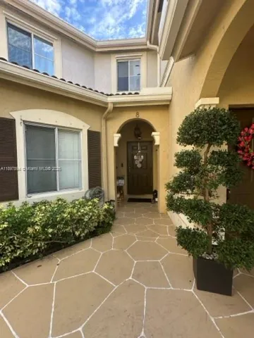a view of a house with a space and garden