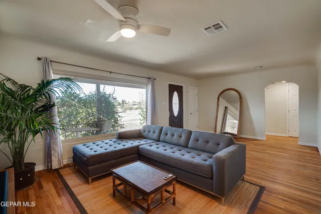 a living room with furniture and a large window