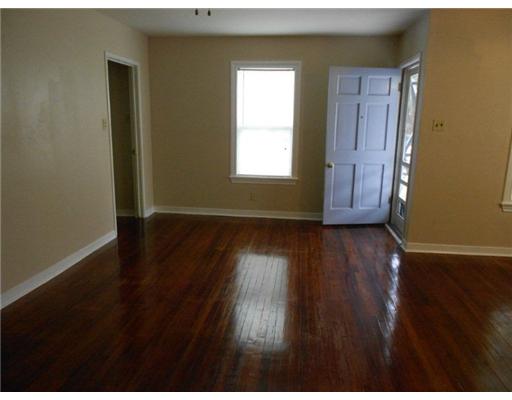 713 Ralston Avenue Corpus Christi, TX 78404 - Photo 3 of 10 a view of wooden floor and windows in a room