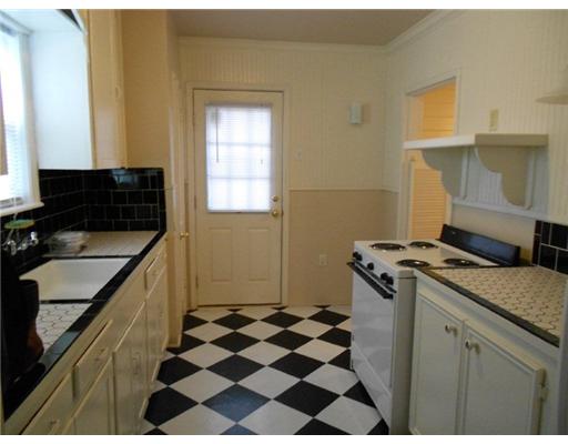 713 Ralston Avenue Corpus Christi, TX 78404 - Photo 5 of 10 a kitchen with a sink a stove and a refrigerator
