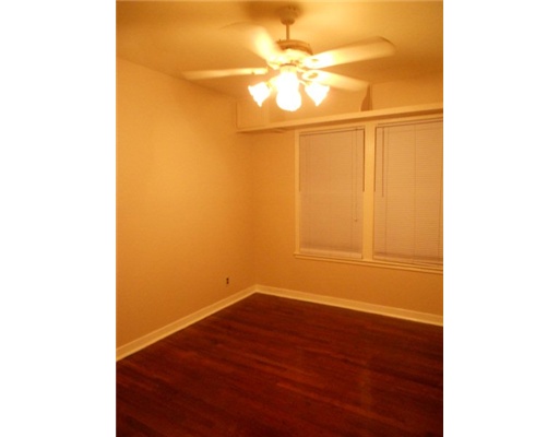 713 Ralston Avenue Corpus Christi, TX 78404 - Photo 8 of 10 a view of a small space with wooden floor and a window