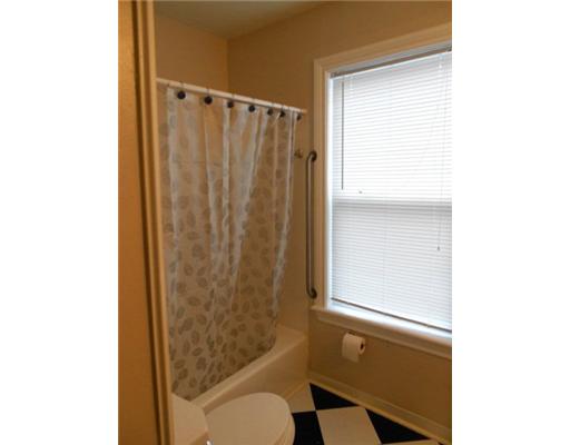 713 Ralston Avenue Corpus Christi, TX 78404 - Photo 9 of 10 a bathroom with a shower curtain and a sink