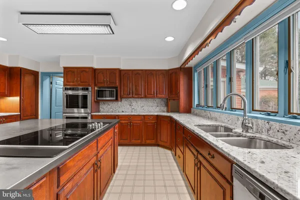 a view of a big room with windows and cabinet