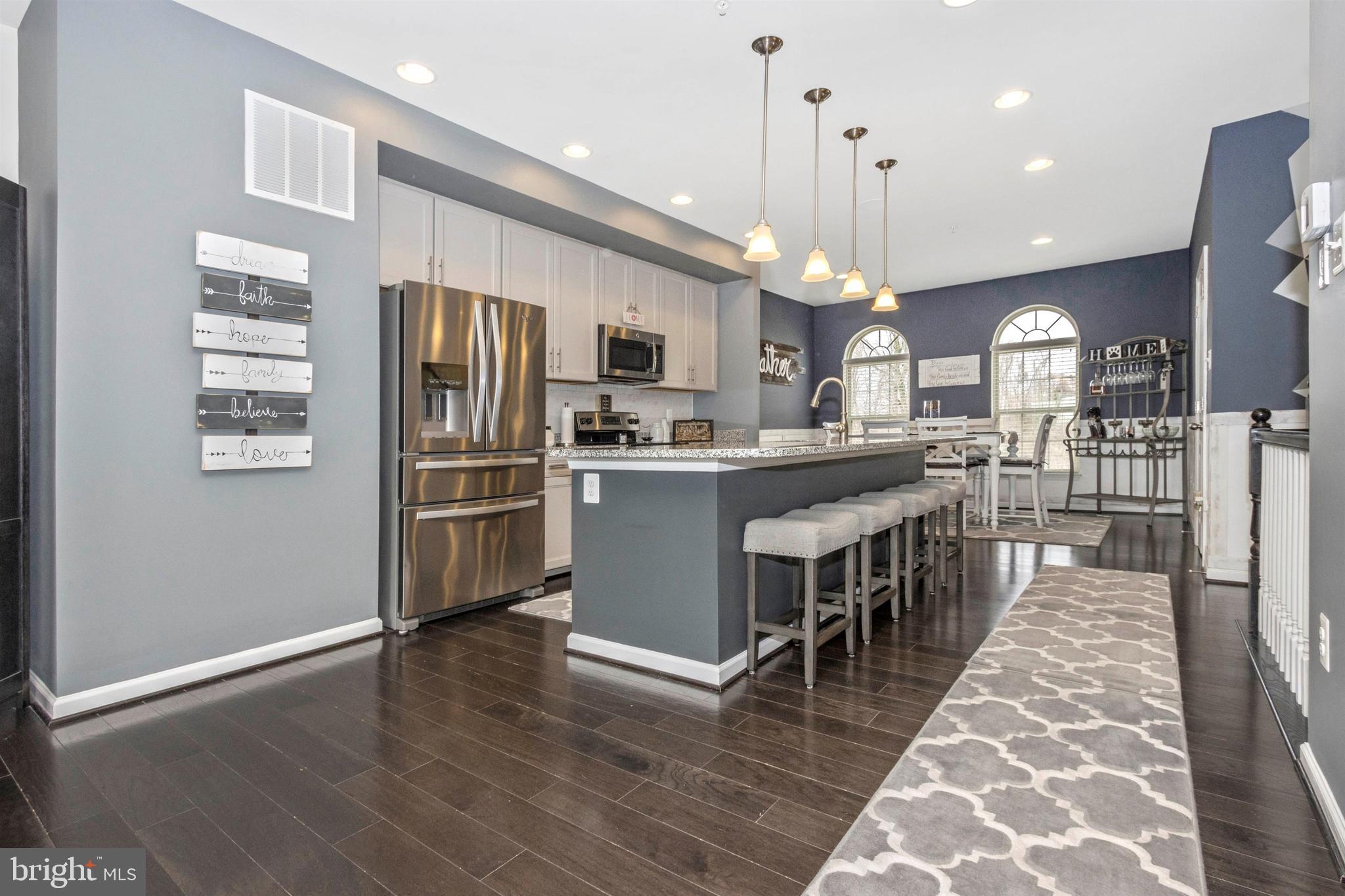 3419 Pintail Road Baltimore, MD 21222 - Photo 8 of 22 Extended center island with pendulum lights