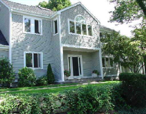 77 Barnes Road Stamford, CT 06902 - Photo 1 of 1 a front view of a house with a yard