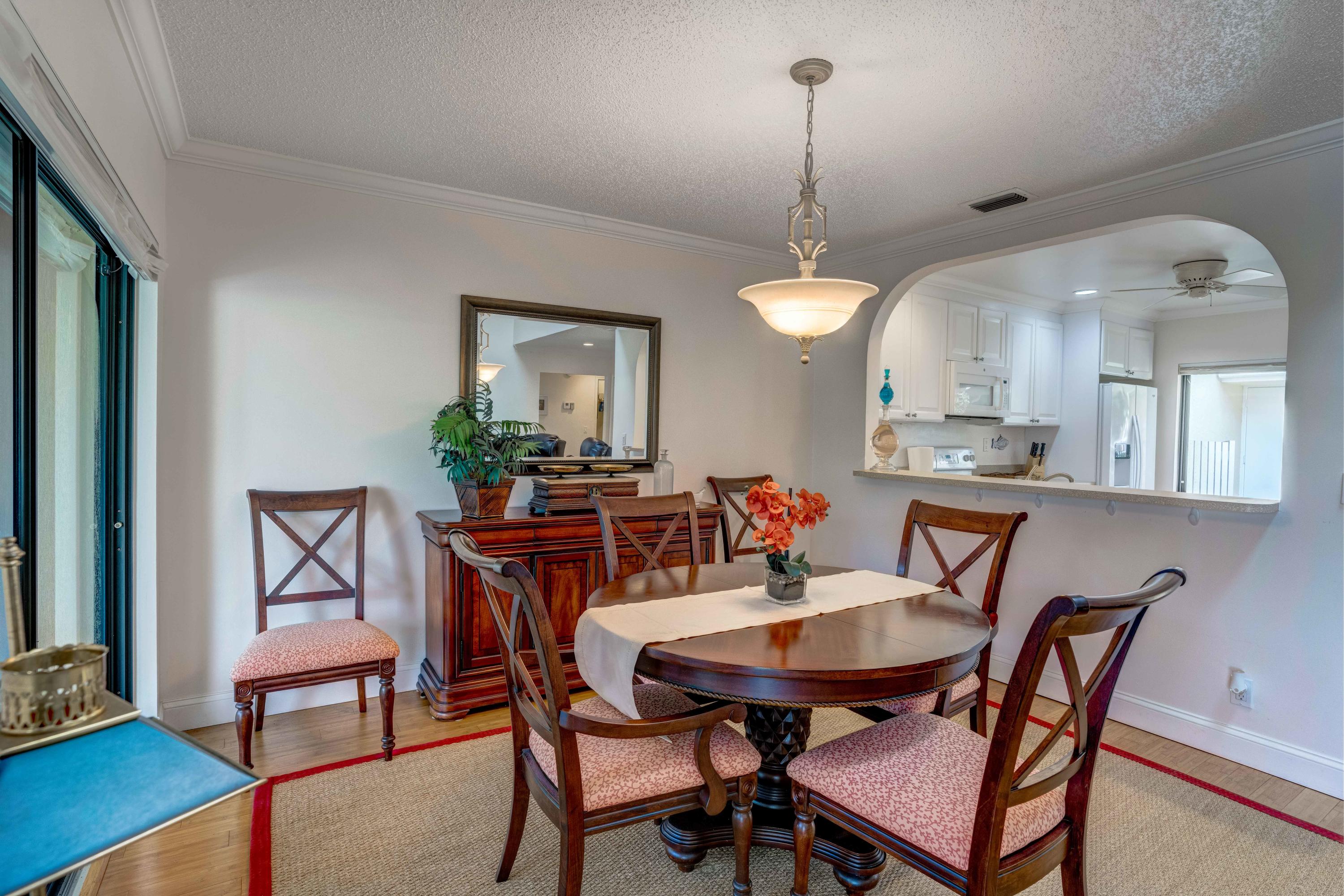 3673 Cape Pointe Circle Jupiter, FL 33477 - Photo 21 of 37 Dinning Area into the Kitchen