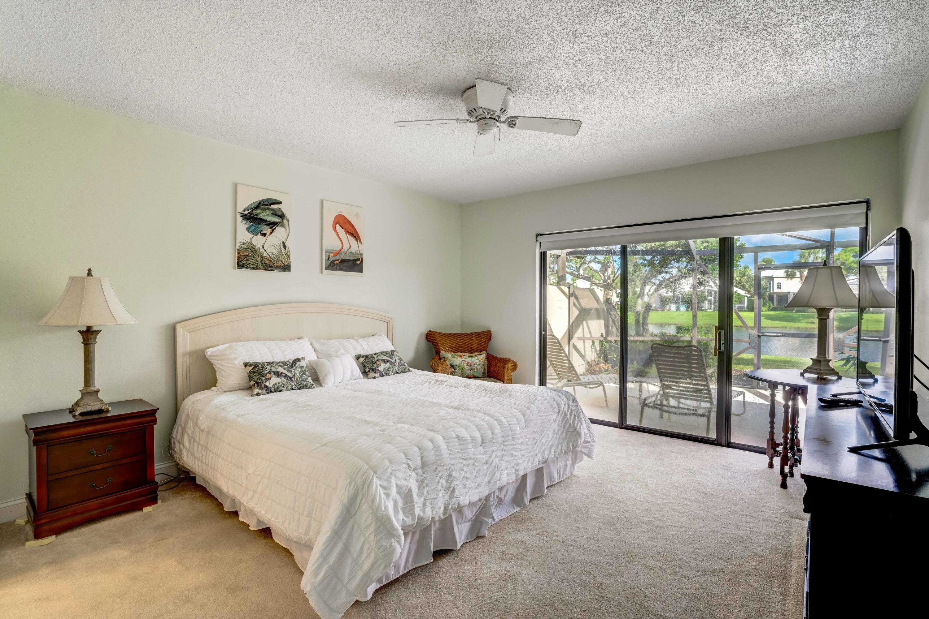 3673 Cape Pointe Circle Jupiter, FL 33477 - Photo 27 of 37 Master Bedroom looking over Lake