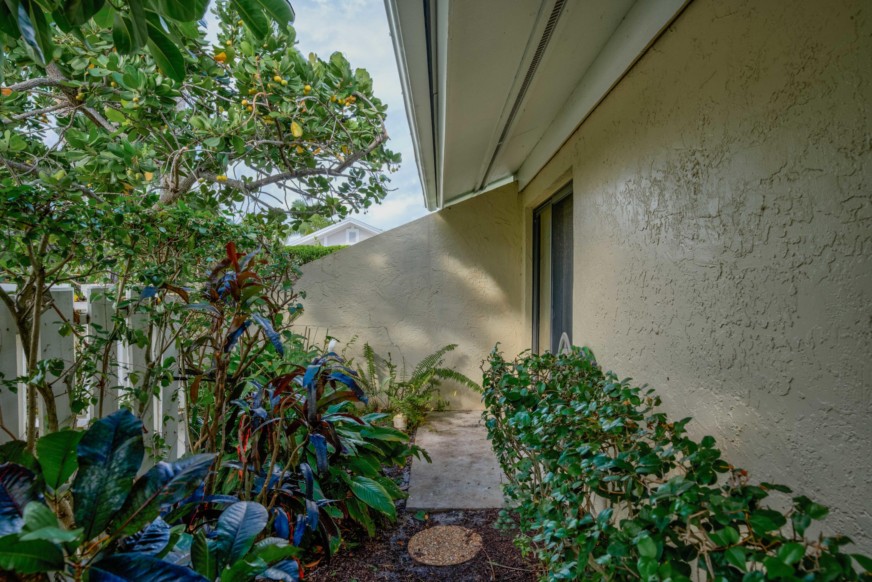 3673 Cape Pointe Circle Jupiter, FL 33477 - Photo 3 of 37 Side Courtyard