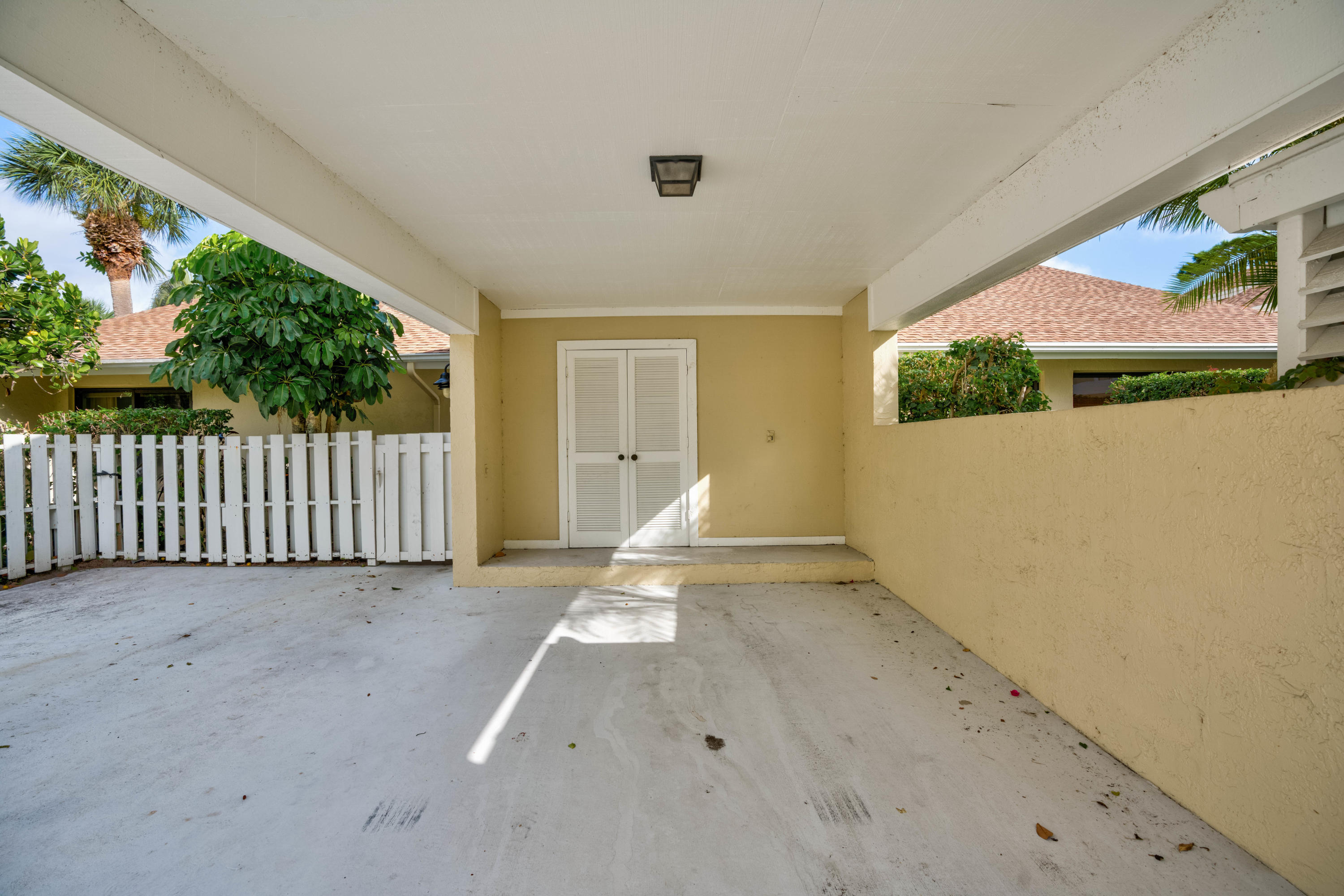 3673 Cape Pointe Circle Jupiter, FL 33477 - Photo 8 of 37 Carport w/Storage Closet