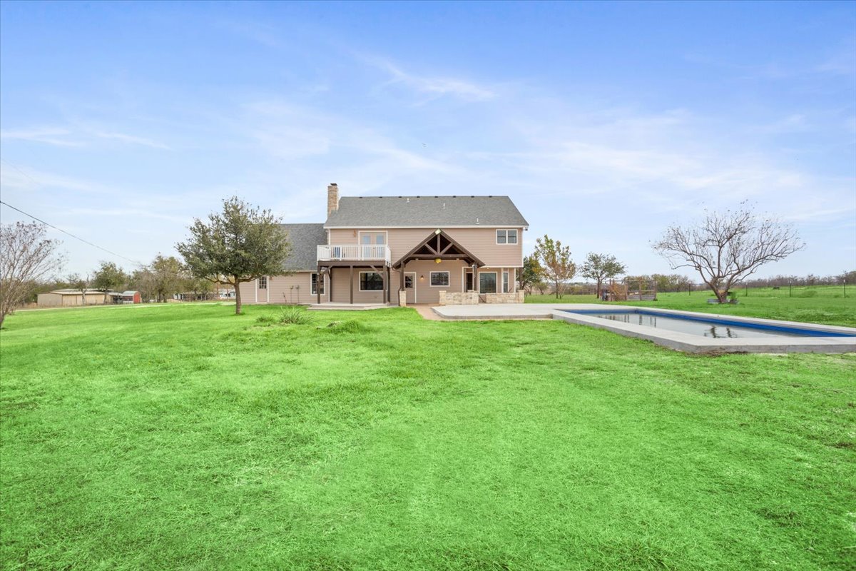 8600 Five Wells Road Rogers, TX 76569 - Photo 26 of 40 a view of a house with a big yard